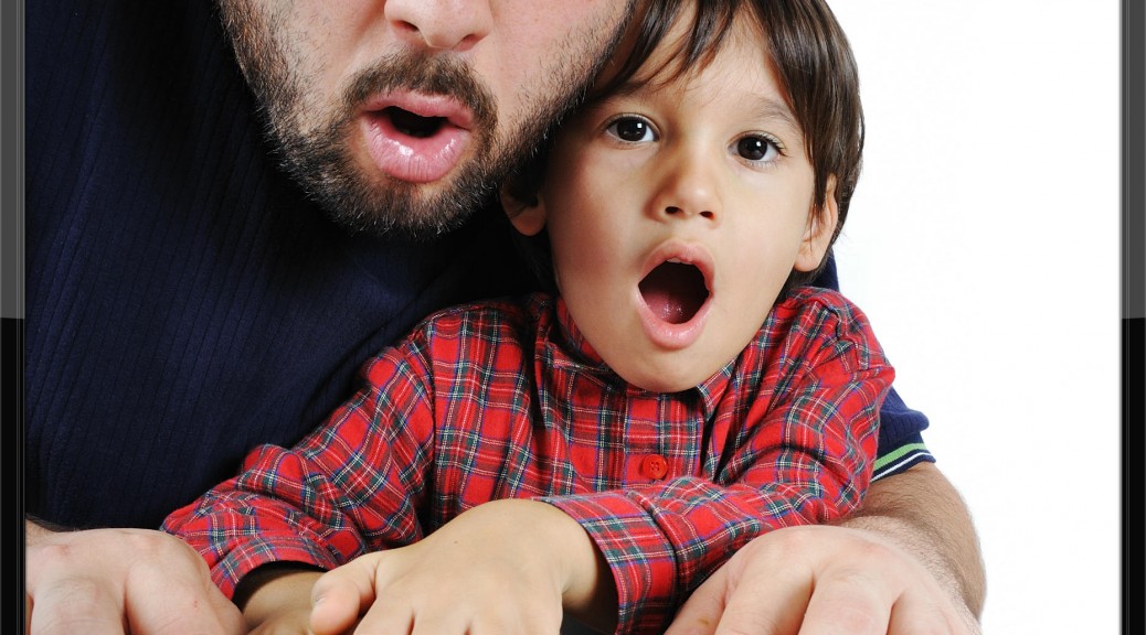 Father and Son using laptop